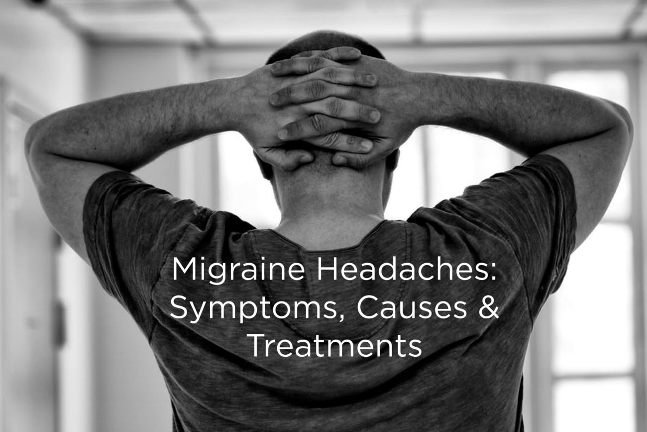 Migraine Headaches-Symptoms, Causes, Treatments-Black and white image of man holding back of head with both hands