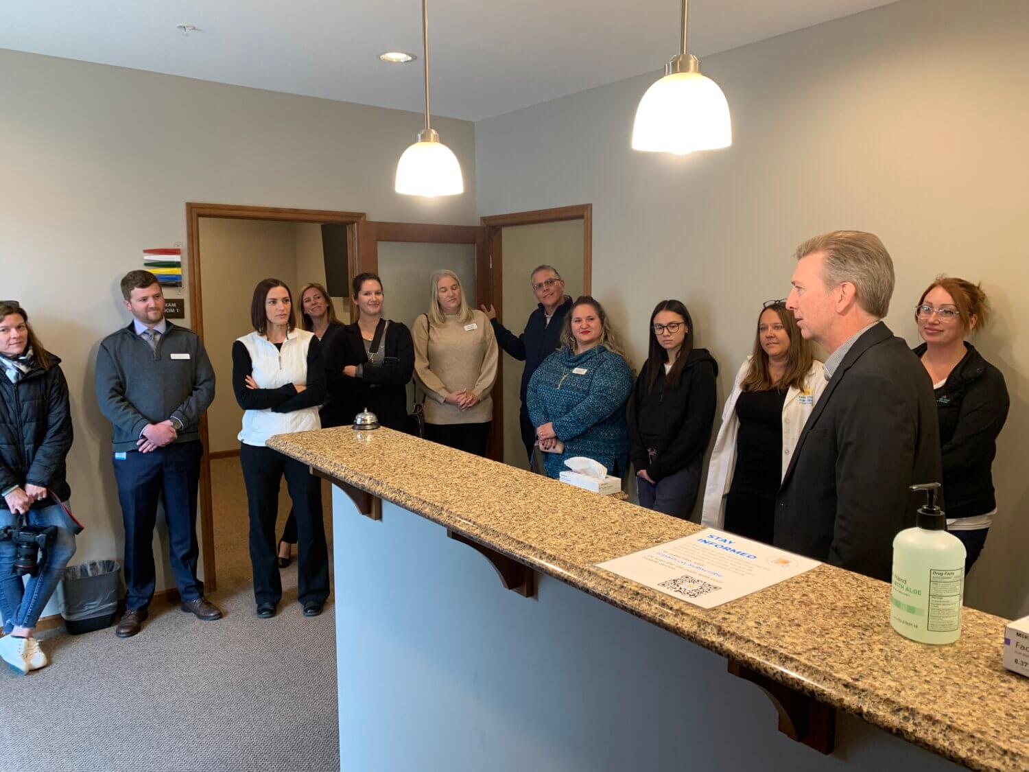 Dr. Andrew Will speaks to the attendees of the ribbon cutting ceremony for Twin Cities Pain Clinic in Chaska, MN