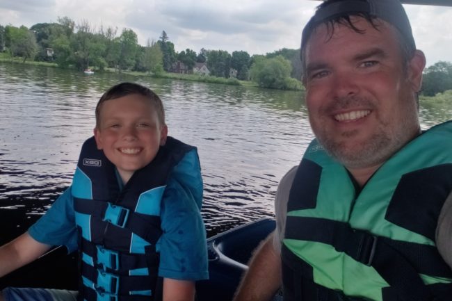 Spinal cord stimulation patient John Quinn kayaking with son