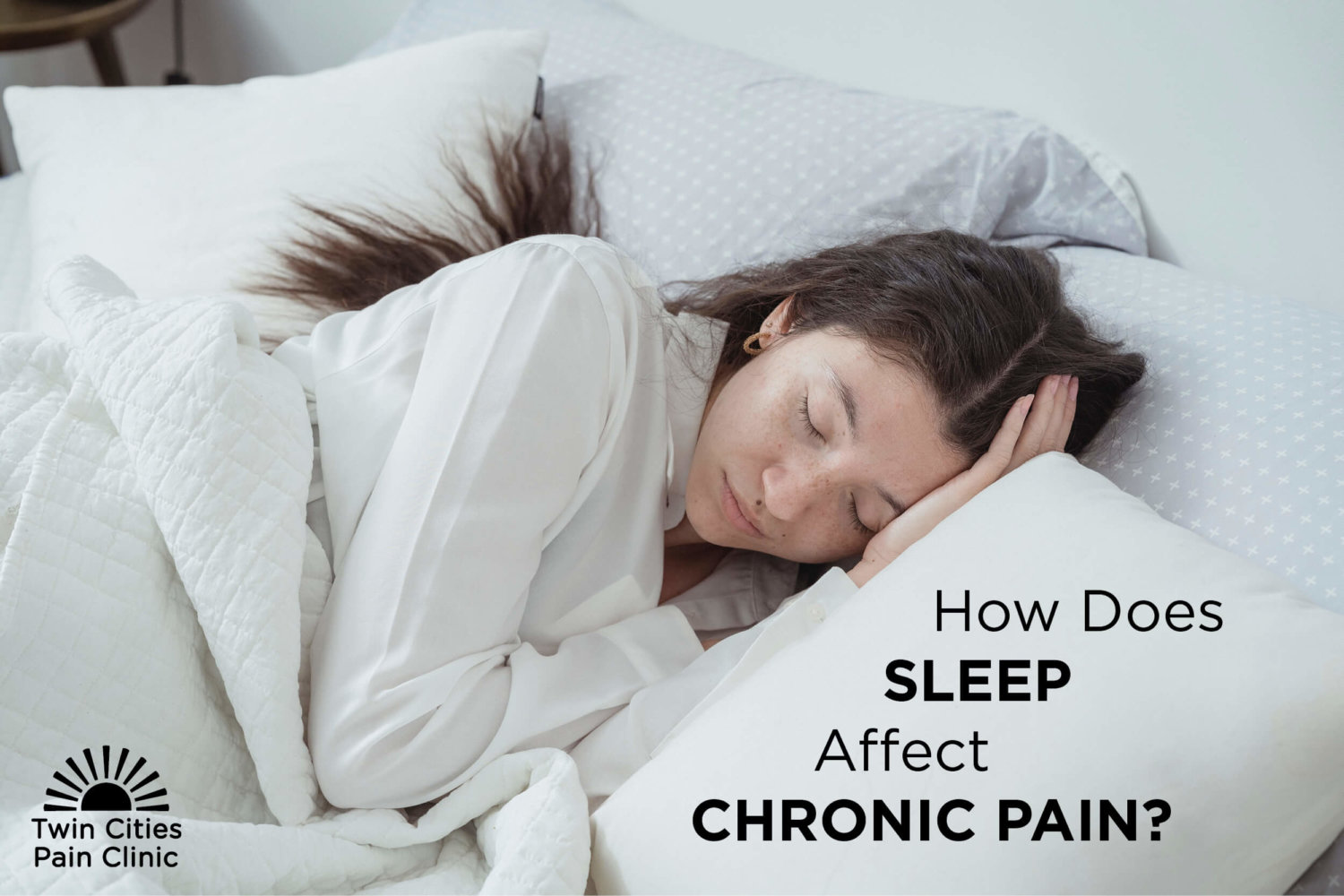 Blog Title-How Does Sleep Affect Chronic Pain-Next to brunette female sleeping on a white pillow