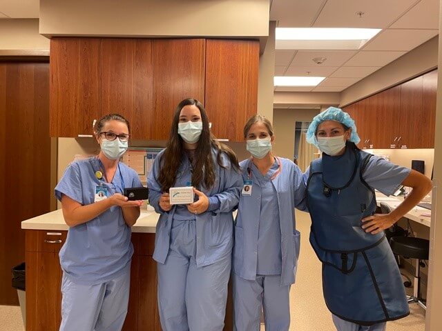 Twin Cities Surgery Center staff with their Bluetooth speakers